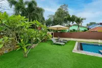 3 Bedroom House for Rent at Garden Ville 1 garden area with sun loungers, parasol, and private swimming pool