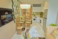 1 Bedroom Condo for Sale at Copacabana Beach Jomtien comfortable bedroom with king-size bed
