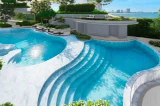 Soondri Wongamat curved building facade with cascading plants and grand entrance