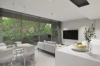 2 Bedroom Condo for Sale at Celine Wongamat living and dining area with kitchen island, pendant lights and tropical garden view