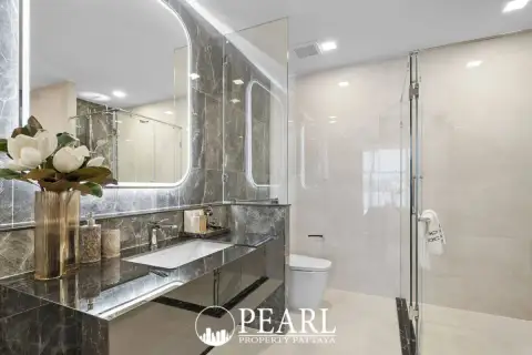 2 Bedroom Condo for Sale at Aquarous Jomtien Pattaya marble bathroom with floating vanity and glass shower
