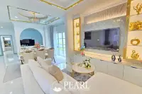 4 Bedroom House for Sale in Baan Suan Suwattana Phase 2 front facade with garden