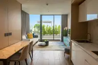 1 Bedroom Condo for Rent at Beverly Mountain Bay Pattaya open-plan living room and marble kitchen with balcony view