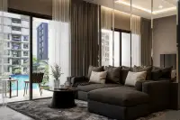 3 Bedroom Condo for Sale at Zenith 2: Modern bedroom with dark gray bedding, black marble accent wall, and garden view.