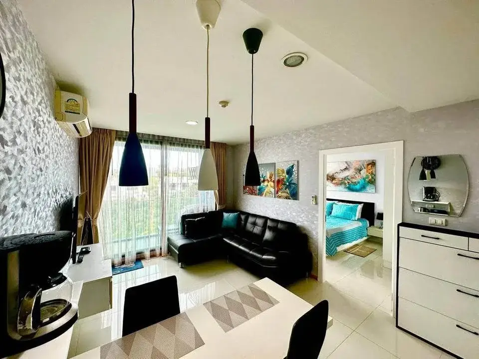 1 Bedroom Condo for Sale at Acqua Condo aerial twilight view of towers with lagoon pool and gardens