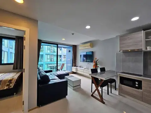 2 Bedroom Condo for Sale at Acqua Condo open-plan living area with kitchenette and view into bedroom