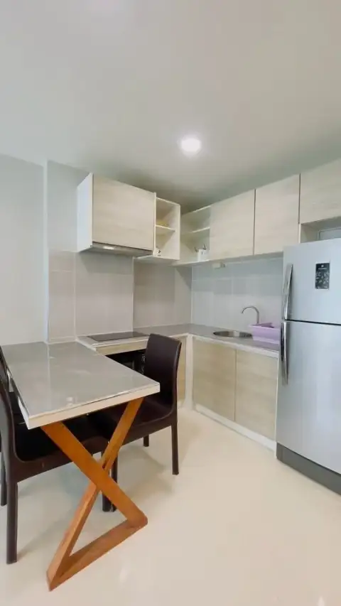 2 Bedroom Condo for Sale at Acqua Condo compact kitchen with stainless steel refrigerator and dining table