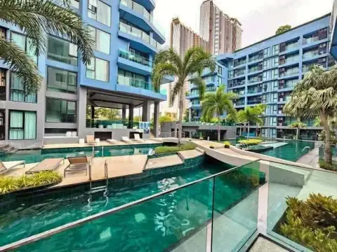 1 Bedroom Condo for Rent at Acqua Condo outdoor lagoon-style swimming pool with palm trees and city view