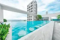 1 Bedroom Condo for Sale at Aeras rooftop infinity pool with high-rise tower backdrop