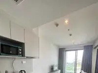 1 Bedroom Condo for Sale at Aeras ceiling view with kitchen cabinets and balcony window