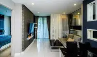 1 Bedroom Condo for Sale at Apus hallway view of living area with sheer curtains and mirrored wall