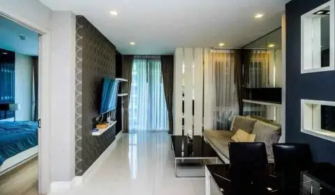 1 Bedroom Condo for Sale at Apus hallway view of living area with sheer curtains and mirrored wall