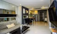 1 Bedroom Condo for Sale at Apus open-plan living room with sofa, dining table and kitchenette