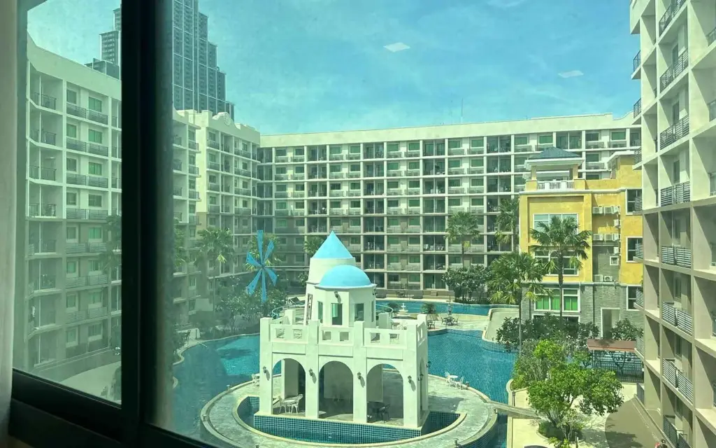 2 Bedroom Condo for Sale at Arcadia Beach Continental view of resort-style pool with Santorini-inspired domed pavilion and surrounding towers