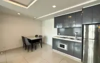 2 Bedroom Condo for Sale at Arcadia Beach Continental open-plan kitchen with gray cabinetry, stainless fridge and dining table