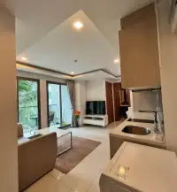2 Bedroom Condo for Rent at Arcadia Beach Resort open kitchen counter with balcony view and living room