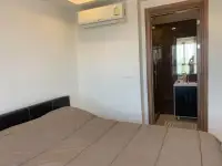 2 Bedroom Condo for Rent at Arcadia Beach Resort bedroom with air conditioning and en-suite bathroom entrance