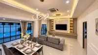 3 Bedroom House for Sale at Areeya Villa open-plan living and dining area with modern chandelier and pool view