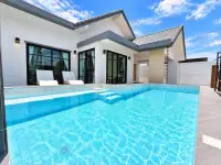 3 Bedroom House for Sale at Areeya Villa daytime exterior view of villa with turquoise swimming pool