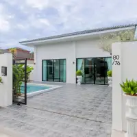 3 Bedroom House for Sale in East Pattaya white single-story villa with private pool and gated entrance