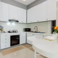 3 Bedroom House for Sale in East Pattaya modern white kitchen with built-in oven and breakfast counter