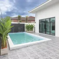 3 Bedroom House for Sale in East Pattaya swimming pool with waterfall feature and poolside patio