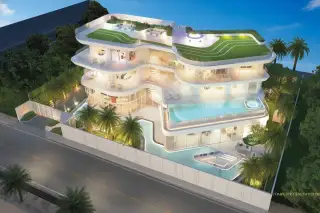 ASONGKHAI Aerial view of modern multi-story house with green roof, multiple balconies, and large swimming pool at dusk.