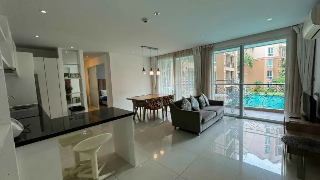 2 Bedroom Condo for Rent at Atlantis Condo Resort open-plan living room and kitchen with balcony pool view