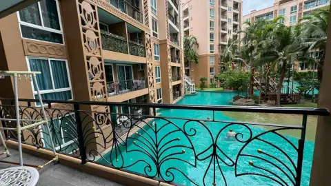 2 Bedroom Condo for Rent at Atlantis Condo Resort balcony view of lagoon pool with ornate iron railing