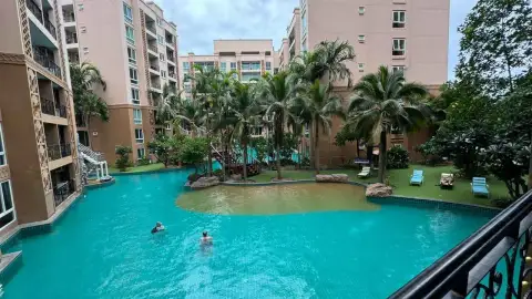 2 Bedroom Condo for Rent at Atlantis Condo Resort lagoon-style swimming pool surrounded by palm trees