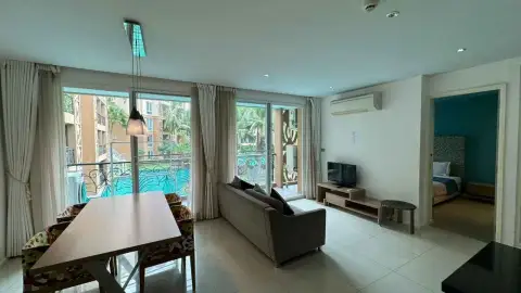 2 Bedroom Condo for Rent at Atlantis Condo Resort living and dining area with pool view and bedroom access