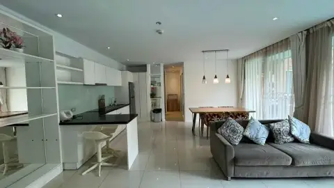 2 Bedroom Condo for Rent at Atlantis Condo Resort kitchen with black countertop, dining table and sofa