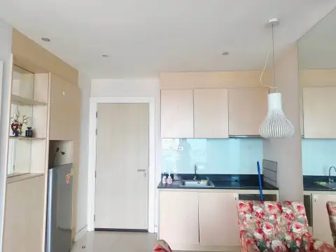 1 Bedroom Condo for Sale at Atlantis Condo Resort kitchen area with wood cabinets and pendant light