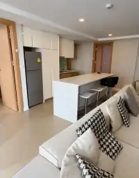 2 Bedroom Condo for Sale at Aurora Pratumnak kitchen with fridge, cabinetry and breakfast bar seating