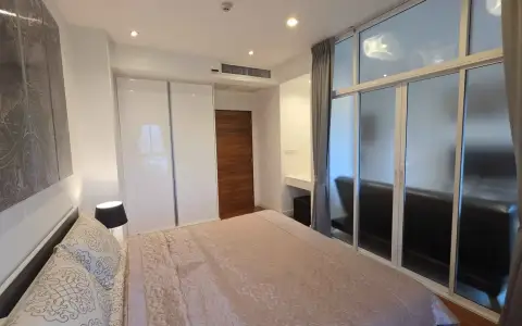 1 Bedroom Condo for Rent at Axis Pattaya Condo bedroom with white wardrobe and large window