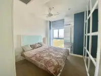 1 Bedroom Condo for Sale at Axis Pattaya Condo bedroom with king-size bed and window view