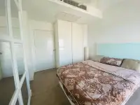 1 Bedroom Condo for Sale at Axis Pattaya Condo bedroom with built-in white wardrobe closet
