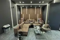 6 Bedroom House for Sale in Bang Lamung media room with large sectional sofa, massage chairs, and ambient lighting.