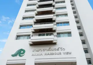 Rama Harbour View condo tower entrance with building signage and balconies