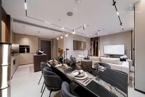 2 Bedroom Condo for Sale at Panora Estuaria open-plan living area with dining table, kitchen, and sofa.