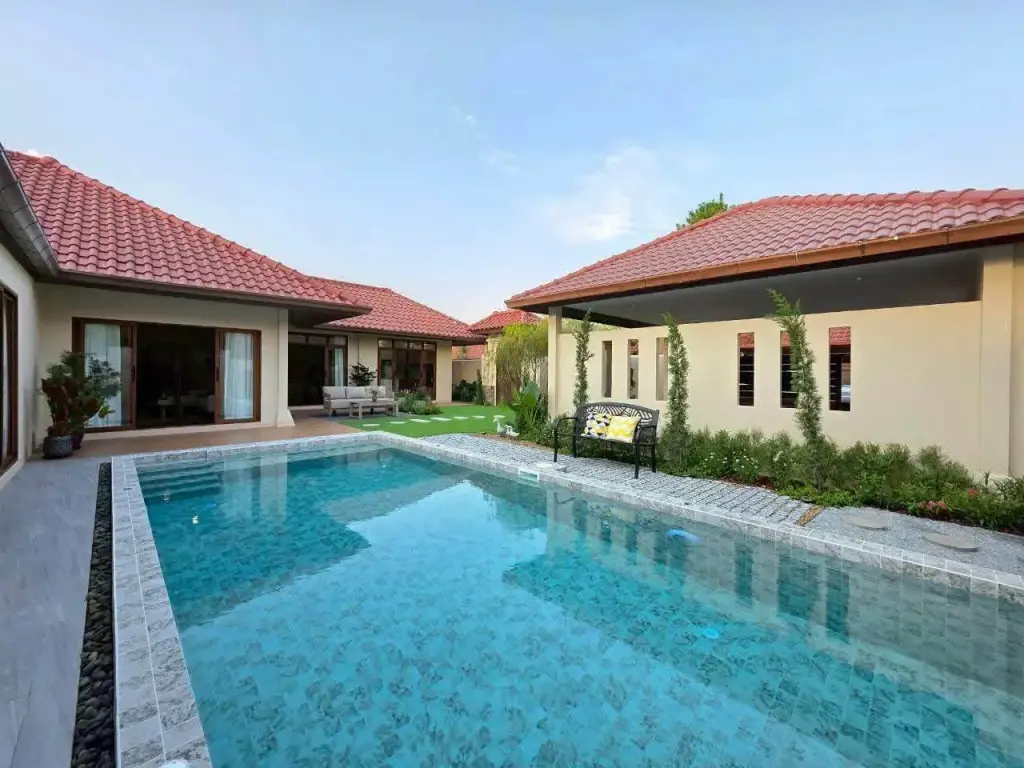 4 Bedroom House for Rent at Baan Balina 3 private pool and red-tiled villa exterior with poolside bench