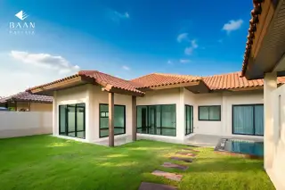 Baan Balina 3: Exterior of the house showcasing large windows, a small pool, and a well-maintained lawn.