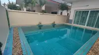 3 Bedroom House for Rent at Baan Dusit Garden 6 tiled swimming pool beside the house with sliding glass doors