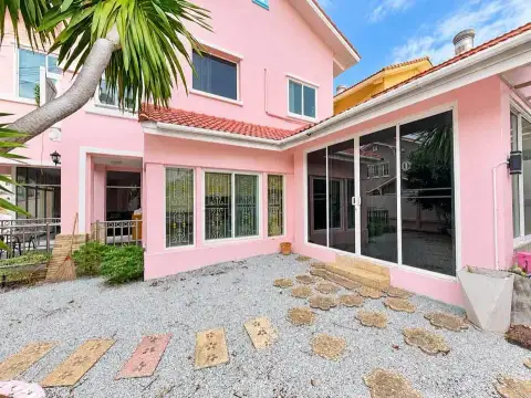 4 Bedroom House for Rent at Baan Fah Rim Haad backyard patio with gravel pathway and sliding glass doors