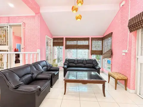 4 Bedroom House for Rent at Baan Fah Rim Haad upstairs living room with black leather sofas and pendant lights