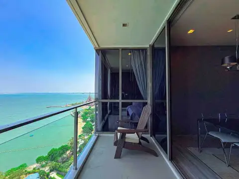 2 Bedroom Condo for Rent at Baan Plai Haad private balcony with wooden chair overlooking the ocean