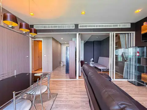 2 Bedroom Condo for Rent at Baan Plai Haad open-plan living and dining space with hallway view