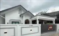 3 Bedroom House for Sale in Bang Lamung white exterior facade with carport and gated entrance
