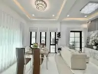 3 Bedroom House for Sale in Bang Lamung open-plan living and dining area with crystal chandeliers