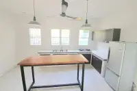 4 Bedroom House for Sale in Bang Sare open-plan kitchen with white countertops and subway tile backsplash